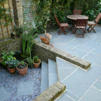 Garden patio in Peckham with new and reused flag stones